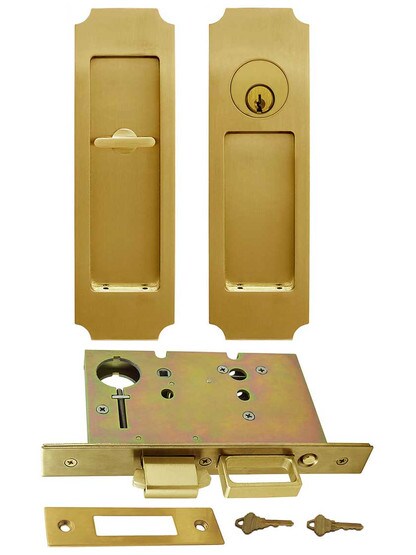 Premium Keyed Pocket-Door Mortise Lock Set with Chamfered Corner Pulls in Aged Brass.